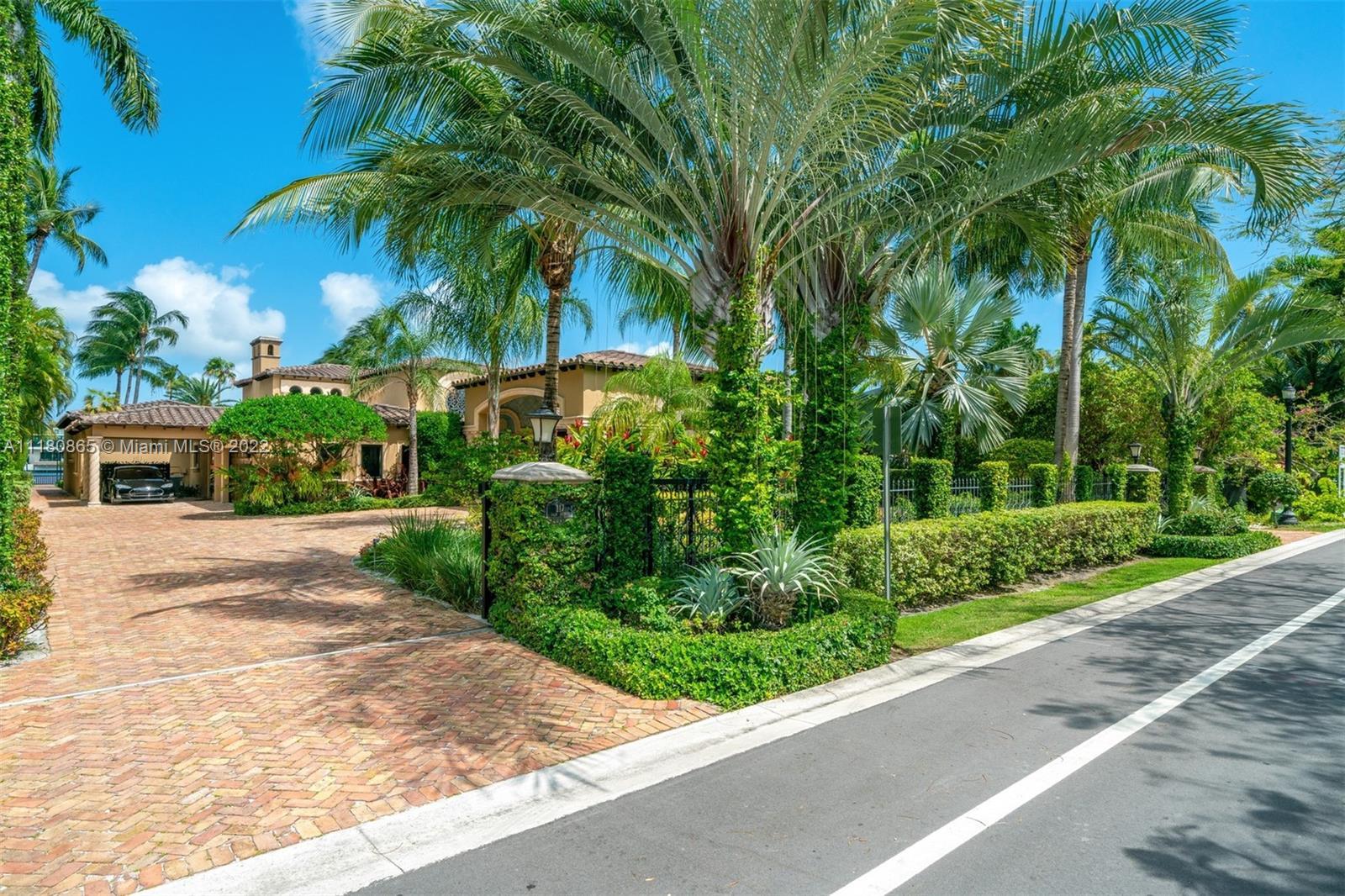 Very special Mediterranean waterfront estate on exclusive, guard-gated Palm Island w/100 ft of water