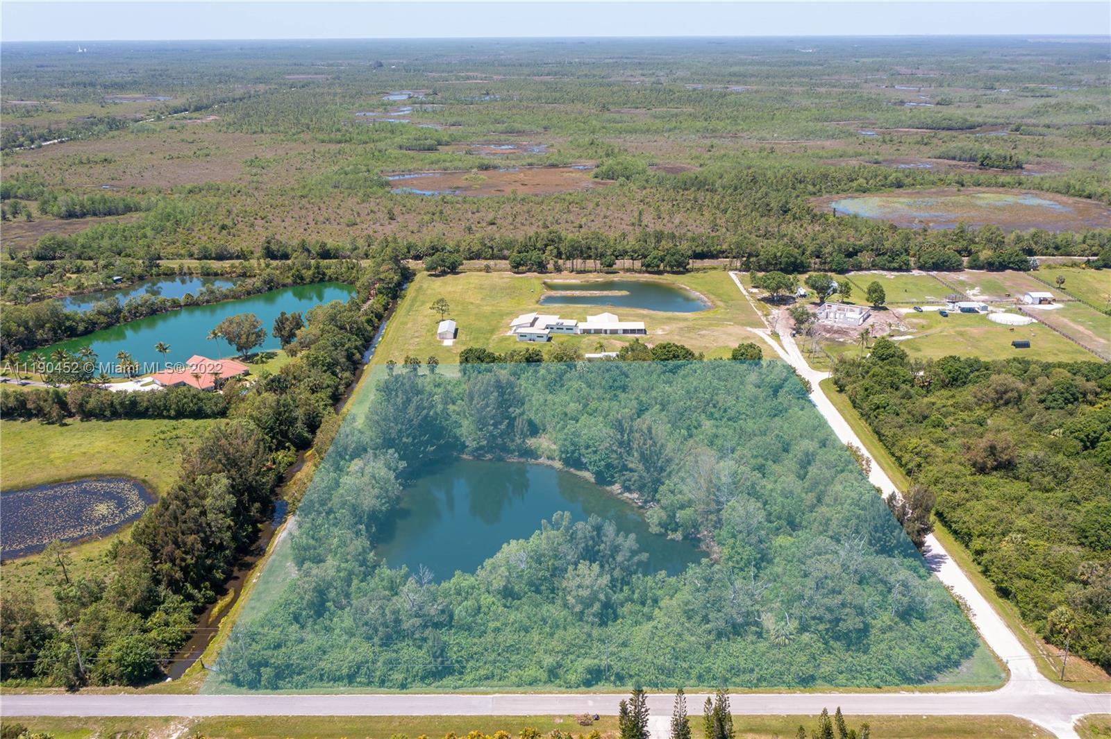 LARGE LAND LOT AVAILABLE IN HIGHLY SOUGHT AFTER, JUPITER FARMS! This 7.06 acre lot is heavily wooded