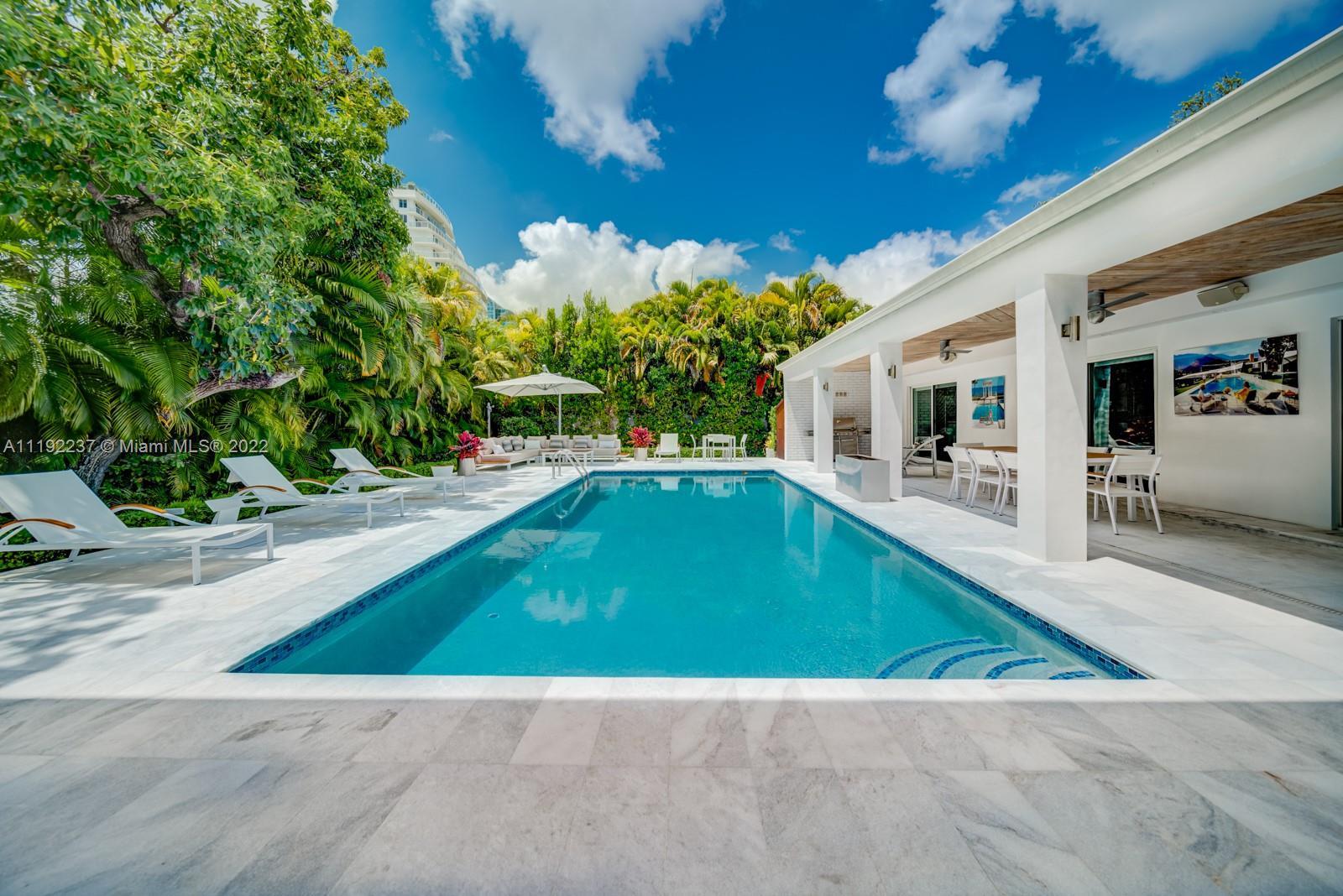 Enchanting modern contemporary residence in Miami’s upscale neighborhood, Bay Point Estates. The bea
