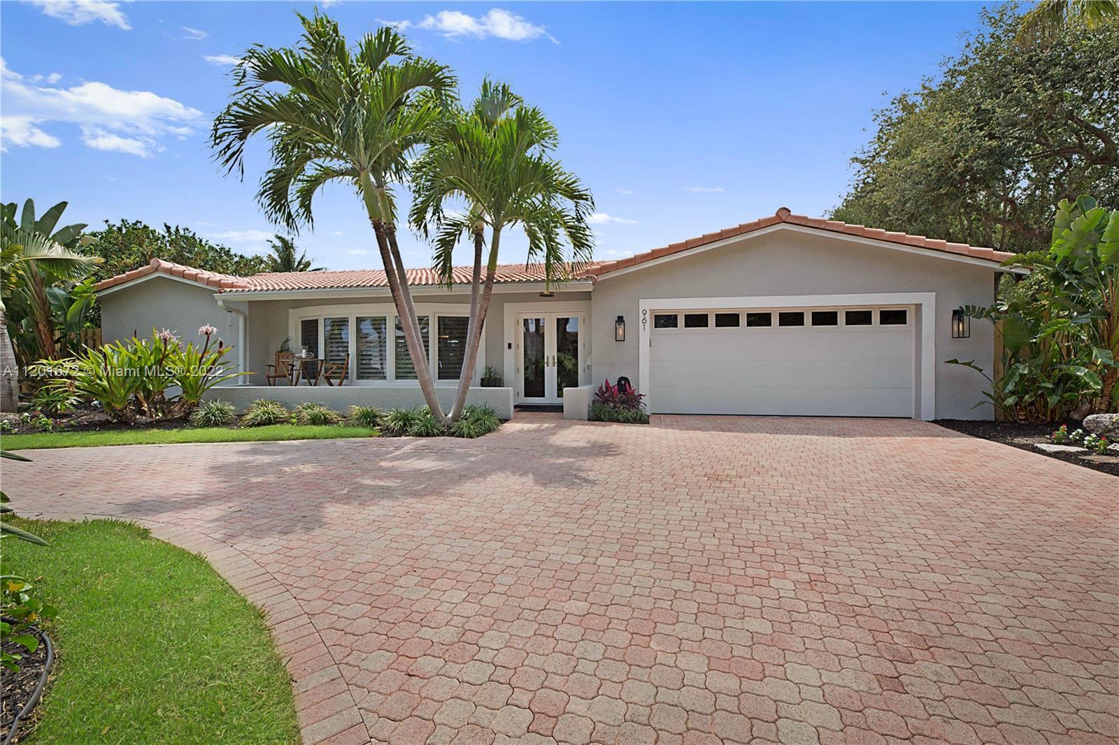 WELCOME TO PARADISE! Tucked in Pompano Beach's prestigious Harbor Village. Huge tropical fenced lot,
