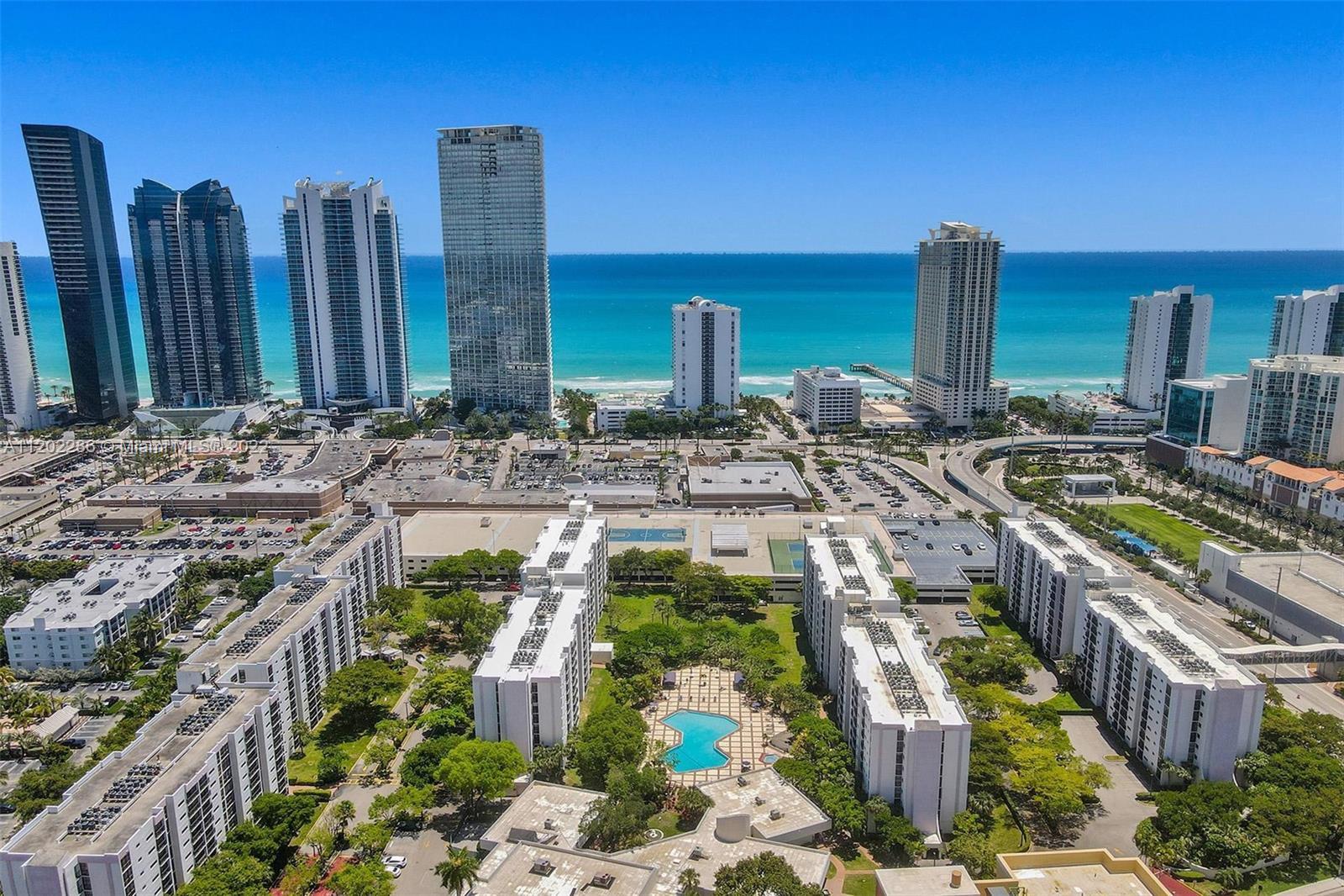 Lovely, bright & spacious condo w/ water views in the heart of Sunny Isles Beach. Across from the be