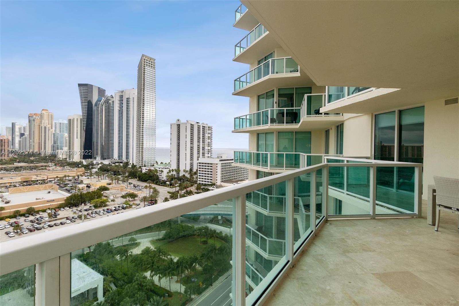 Spectacular contemporary 3 BR 2 BA corner unit with a beautiful city and partial ocean view. High im