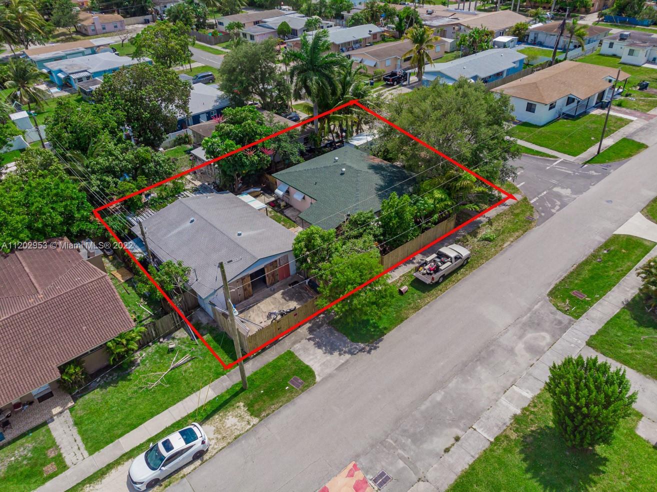 YES!!! AS YOU CAN SEE, THIS FENCED-IN CORNER PROPERTY HAS A HUGE 1,036 sf DETACHED GARAGE ALMOST AS 