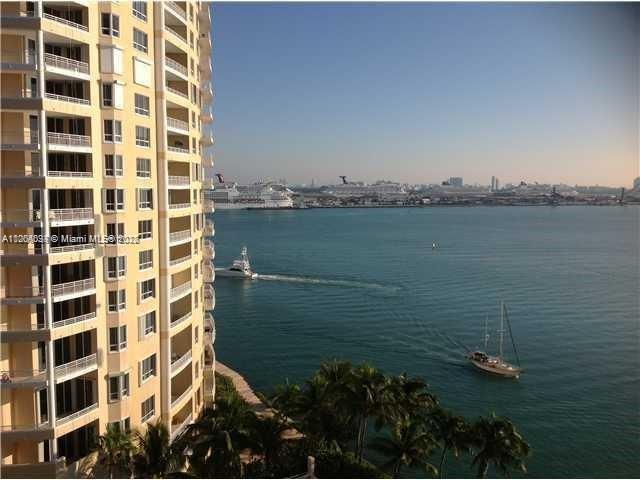 Island living at its best! Beautiful views of Biscayne Bay, pool and gardens. Tile floors throughout