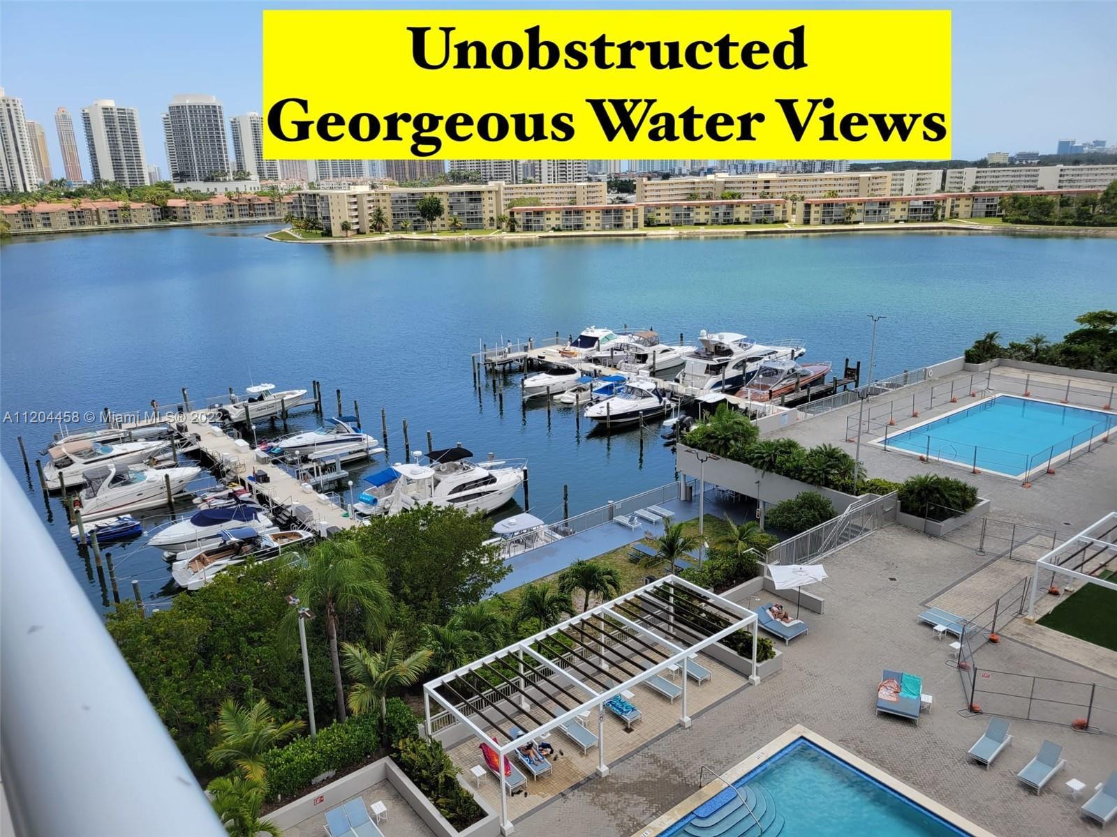 Unobstructed GORGEOUS water views in this HUGE LAYOUT, with spacious living room & dining room area,