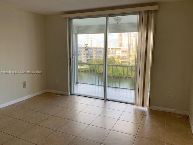 BEAUTIFUL APARMENT AT POINT EAST CONDO. NICE WATER VIEW FROM THIS SCREENED BALCONY, TILED FLOORS, HU