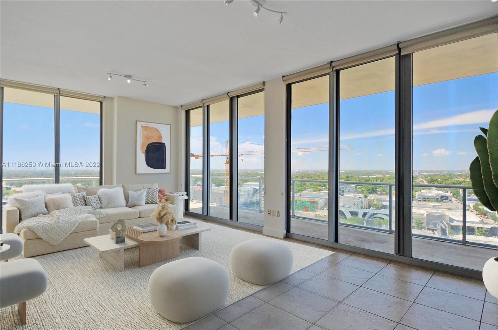 Breathtaking views of Biscayne Bay from this 3 bedroom residence featuring 10 Ft exposed concrete ce