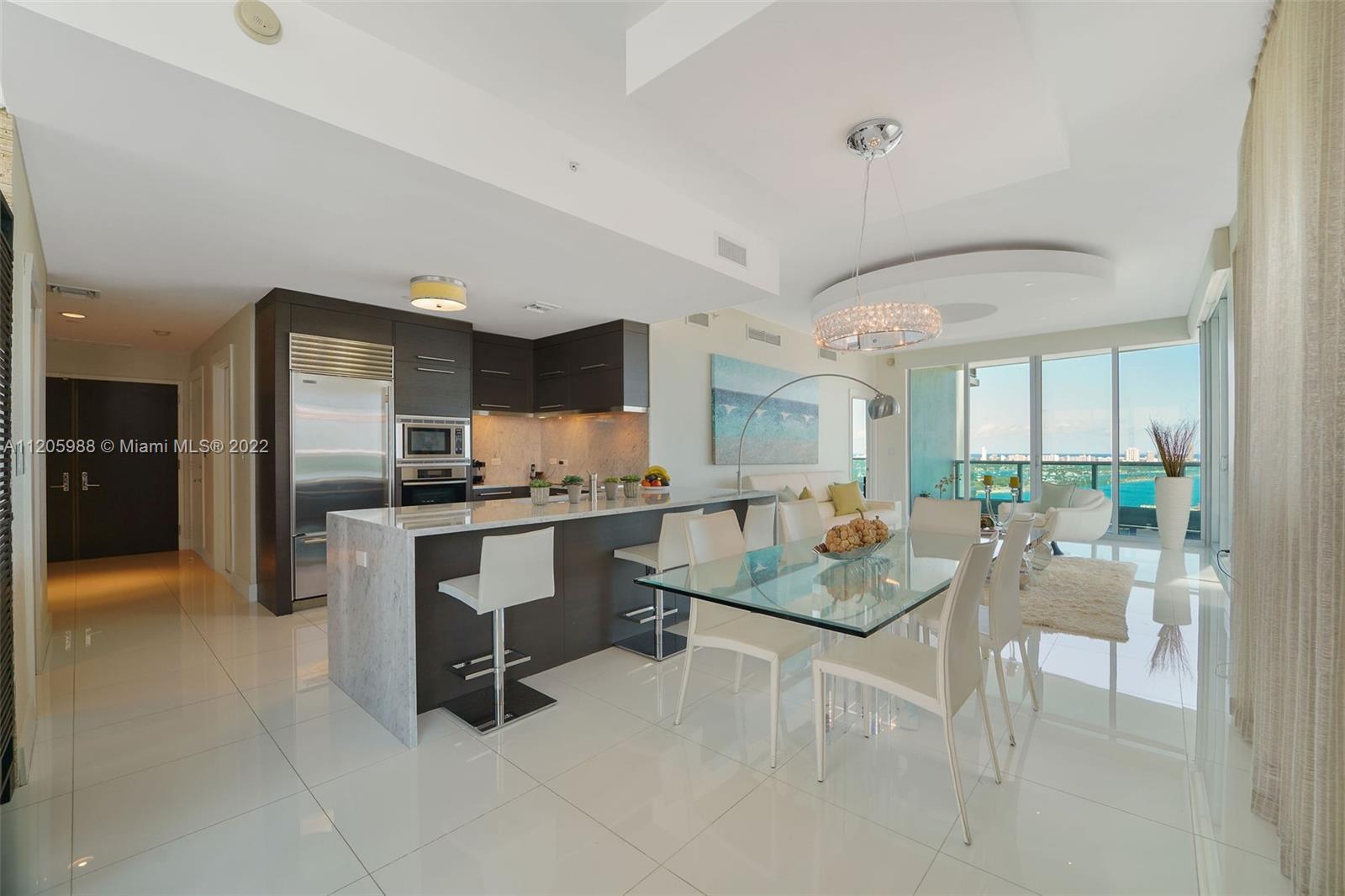 Unusual and spectacular one of a kind corner unit at 900 Biscayne Bay Tower.  Luxurious 3 bedrooms/ 