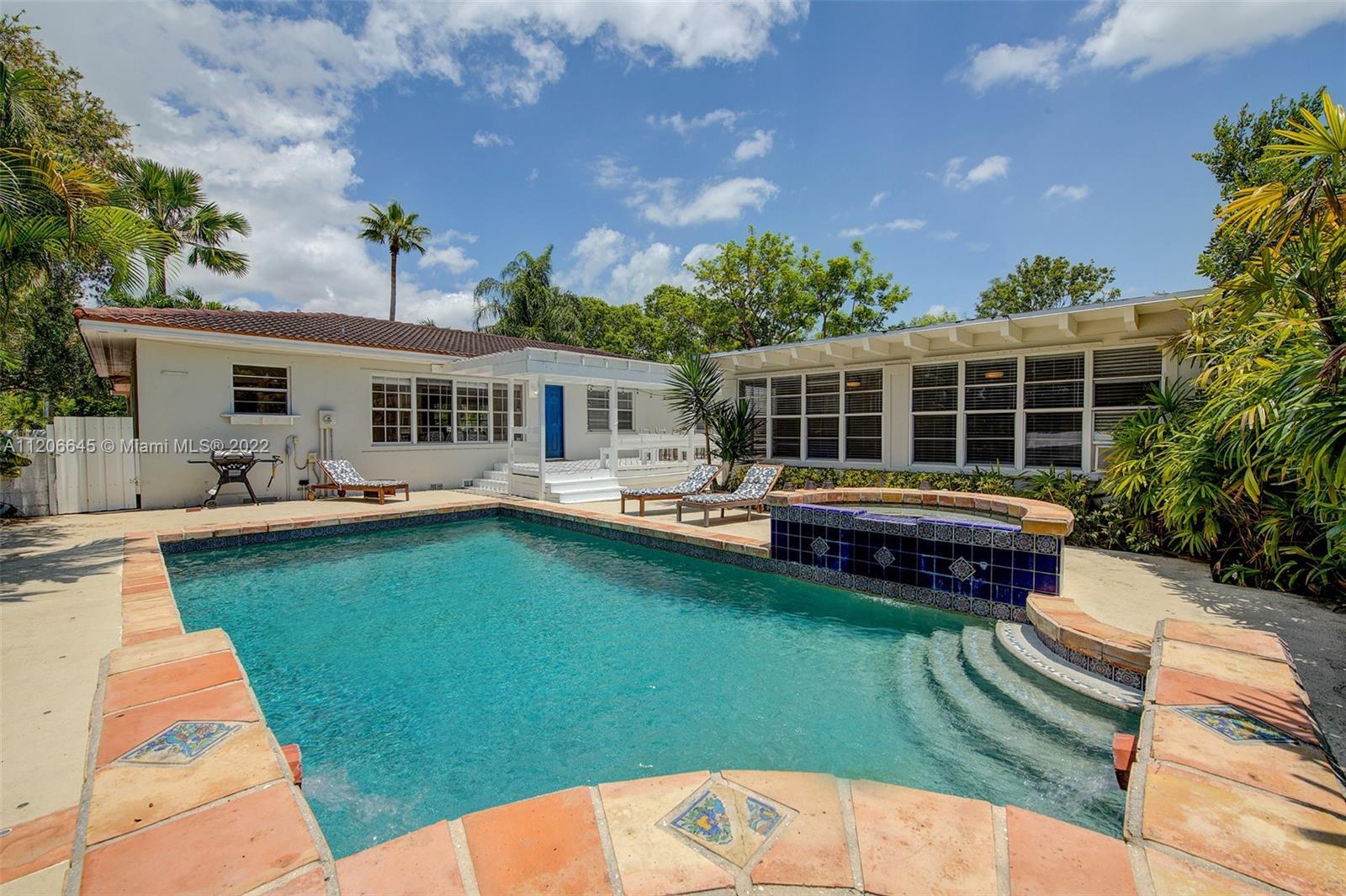 Very Bright and welcoming five bedroom pool home on a gorgeous tucked away street in Miami Shores. N