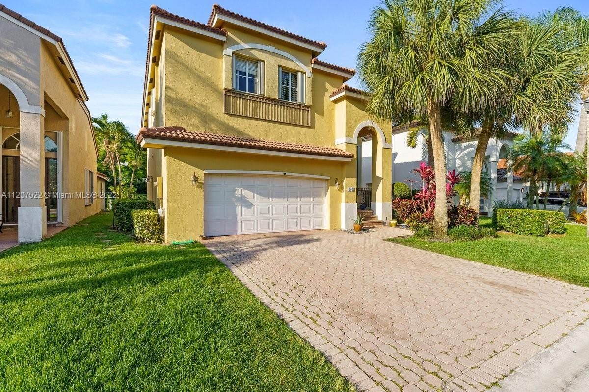 Beautiful 4 bed 3 bath home in 24 hour guard gated golf community Grand Palms.  Accordion shutters t