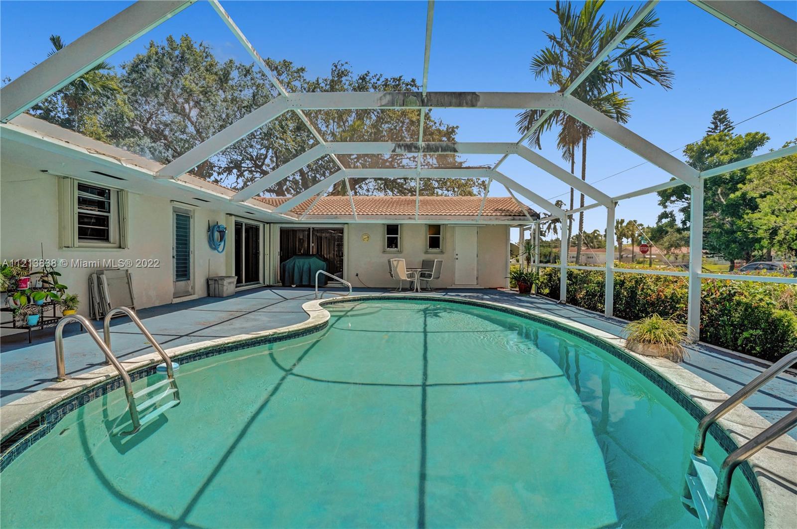 Beautiful pool home on a large corner lot, in the desirable Hollywood Hills. Bright and inviting spa