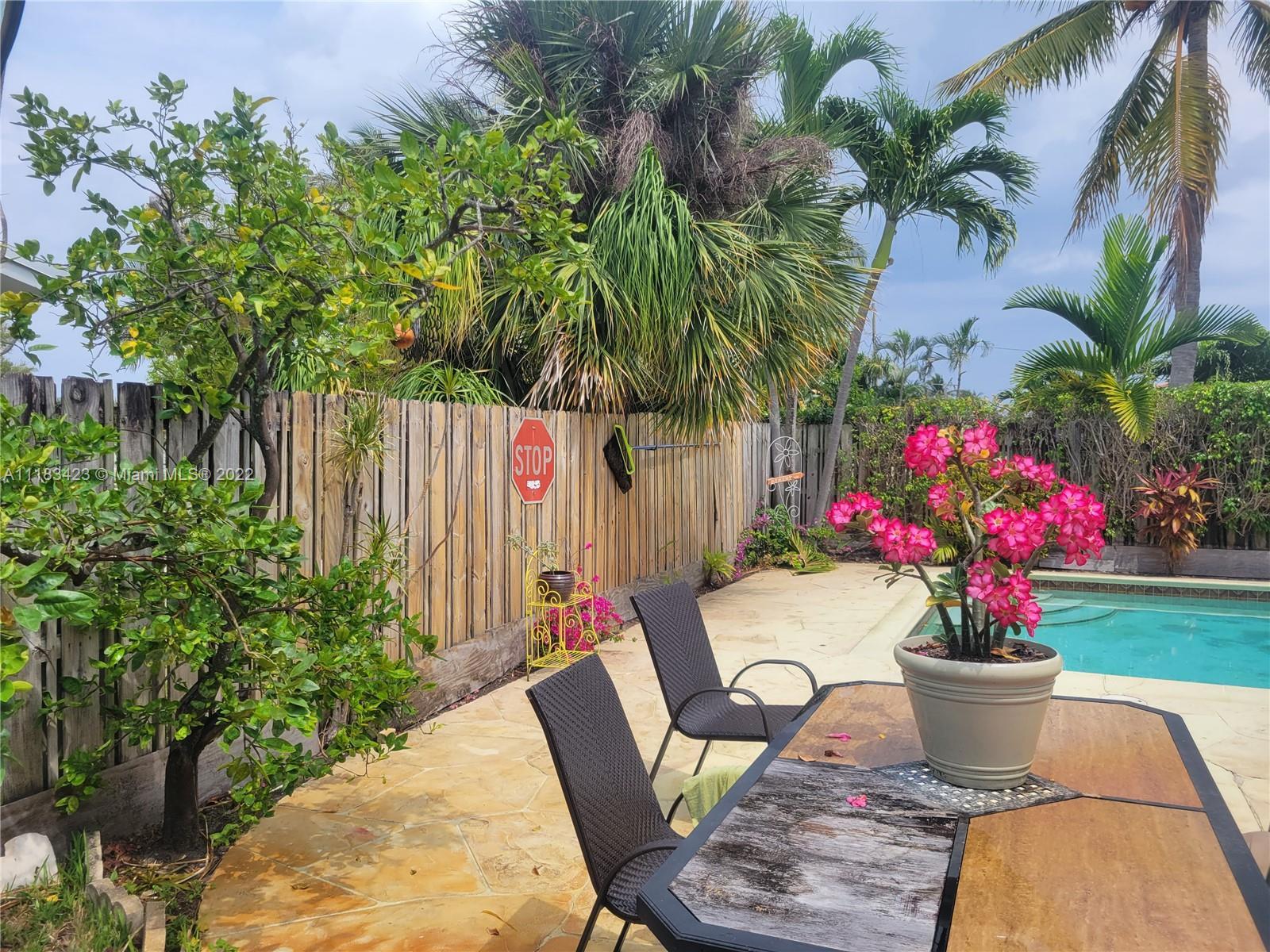 You've found it! The perfect home to experience the South Florida lifestyle! This lovely corner-lot 