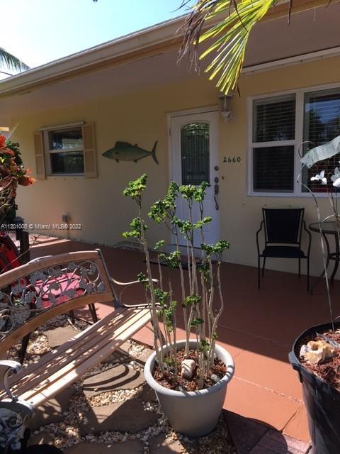 South Florida Living @ its Best! Beautifully maintained 3/2+1 car garage, on fully fenced corner lot