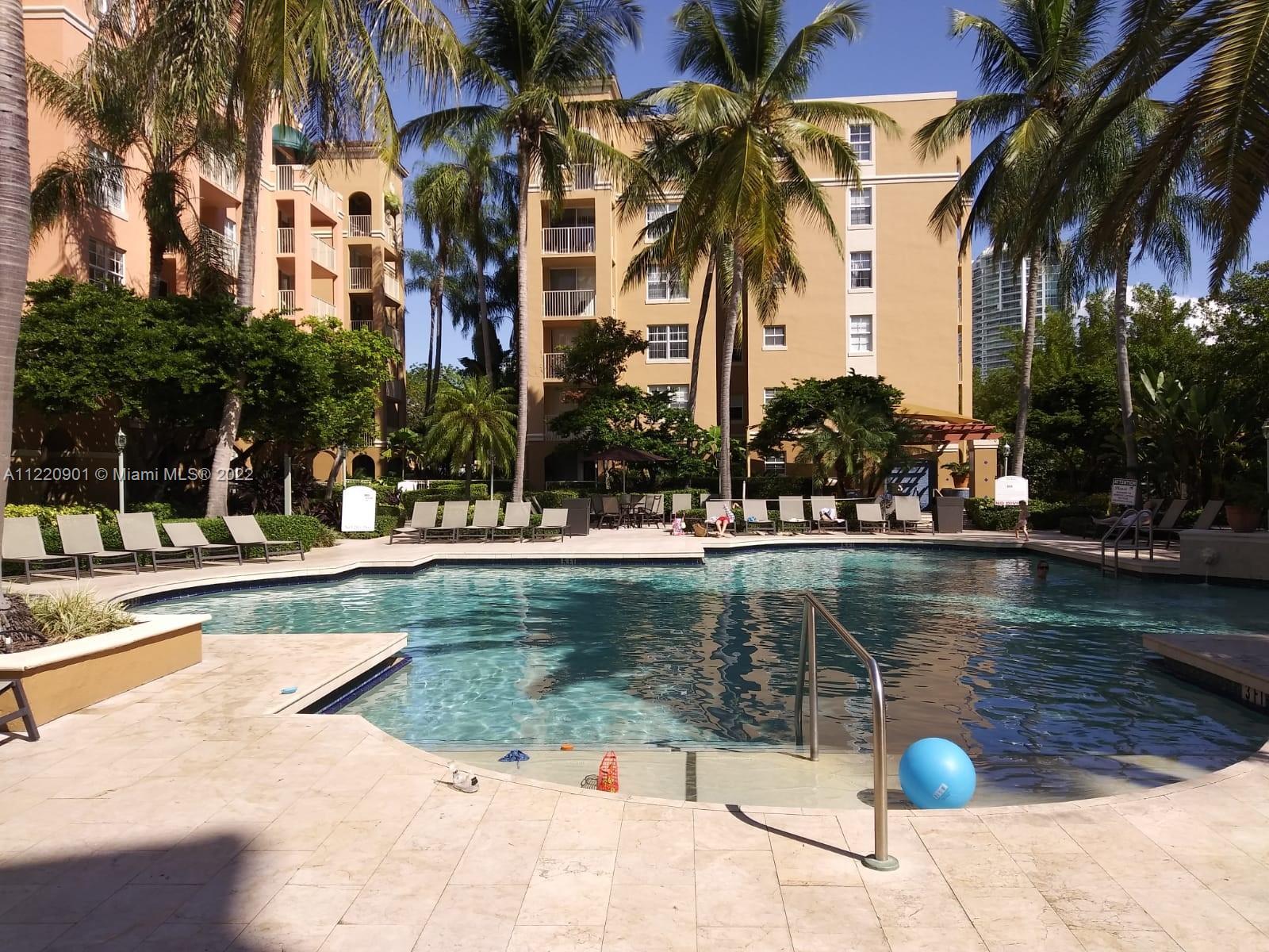 Furnished 1/1 overlooks ng the pool/marina, with covered parking in desirable Yacht Club of Aventura