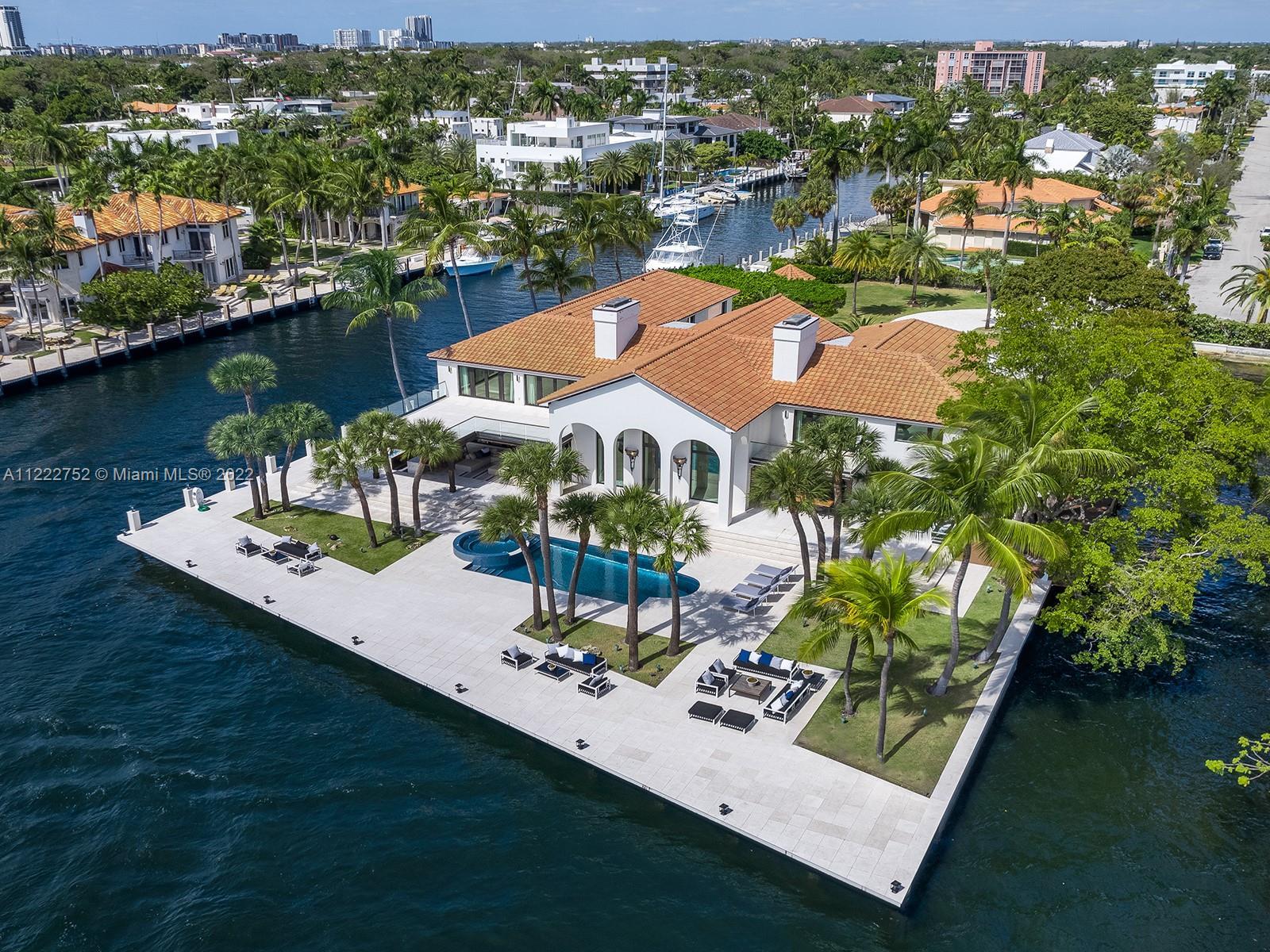 This Las Olas Isles estate has the rare distinction of occupying its own private peninsula, with spe
