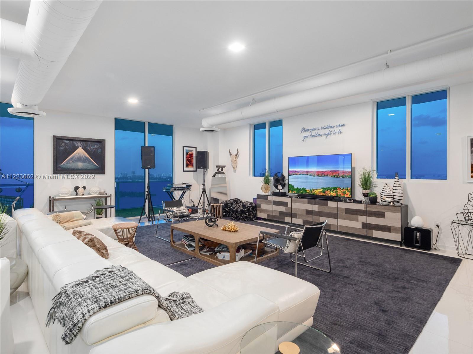 Set your eyes on this incredibly stylish Edgewater Penthouse. Located on a private floor, with priva