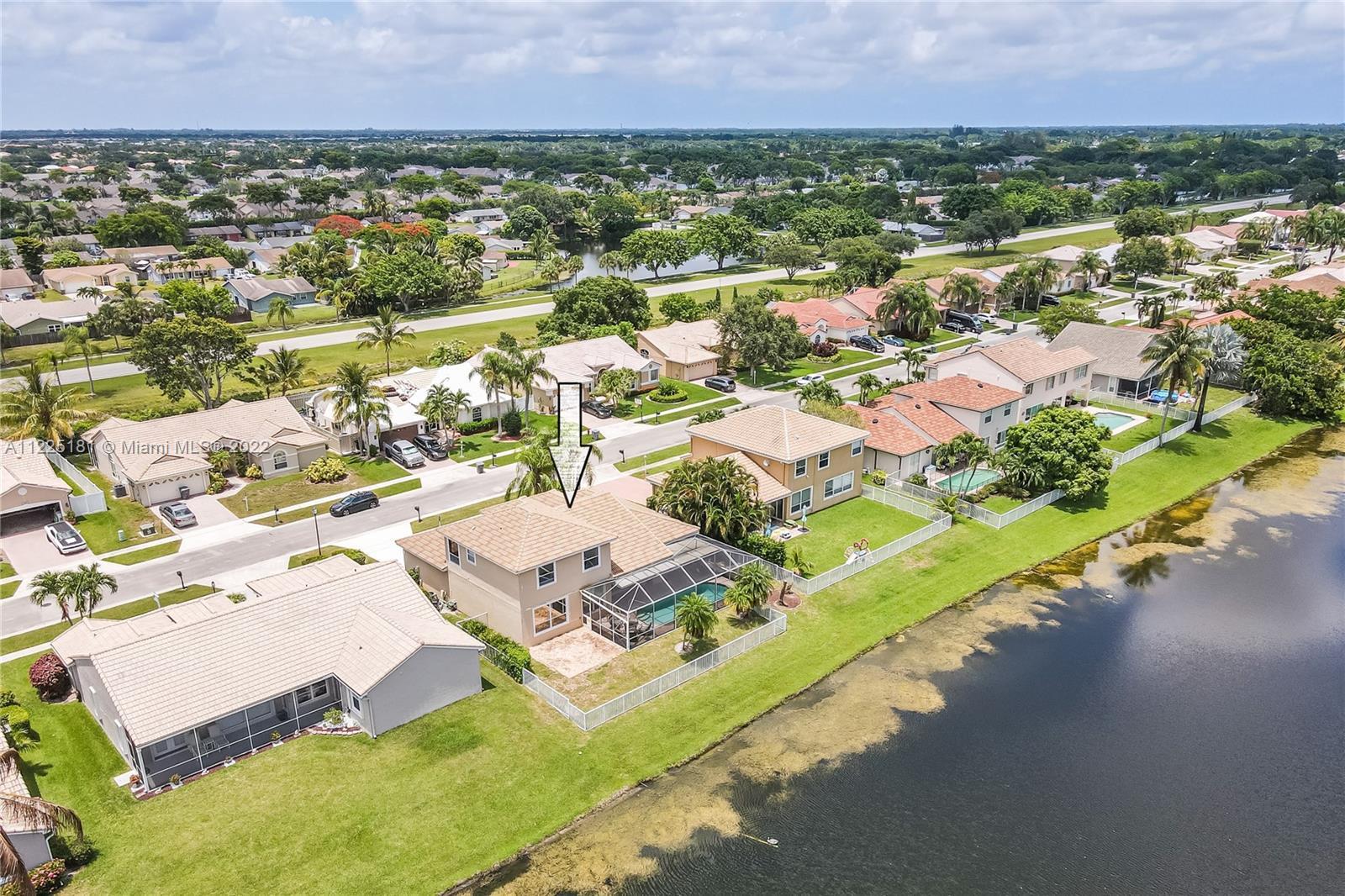 Gorgeous lakefront home with dramatic views! This two-story home is located in the beautiful neighbo