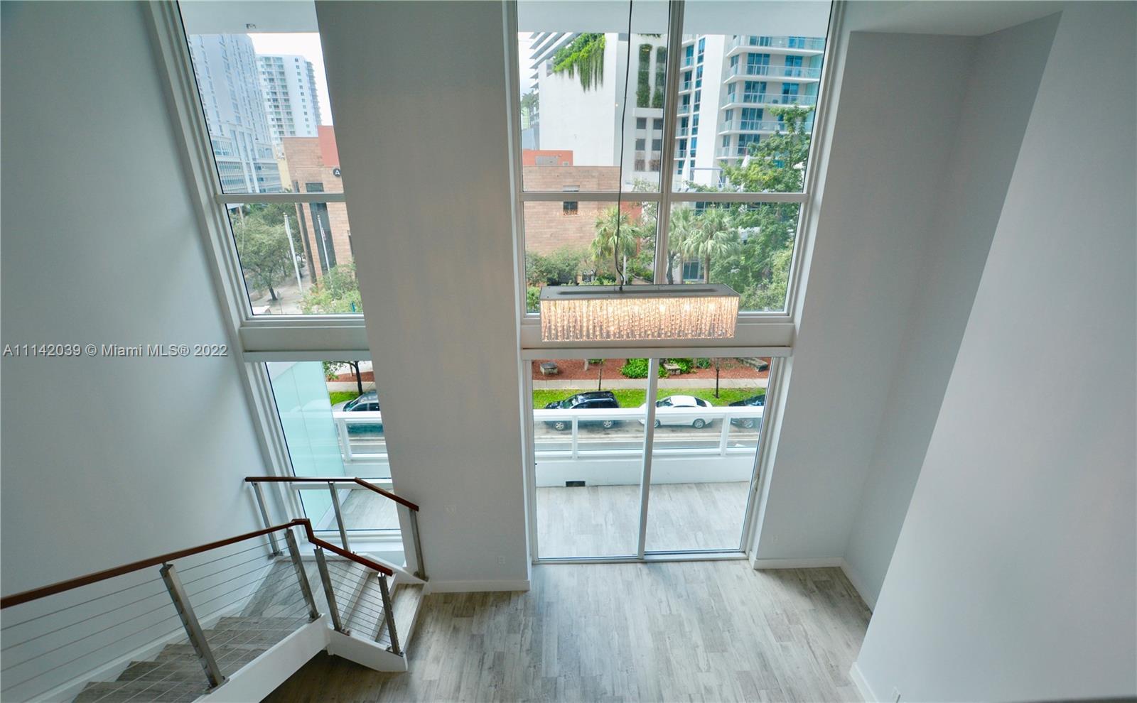 Spectacular Loft Style 1 bed 1.5 bath 2 Story spacious residence in 1080 Bond in the heart of Bricke