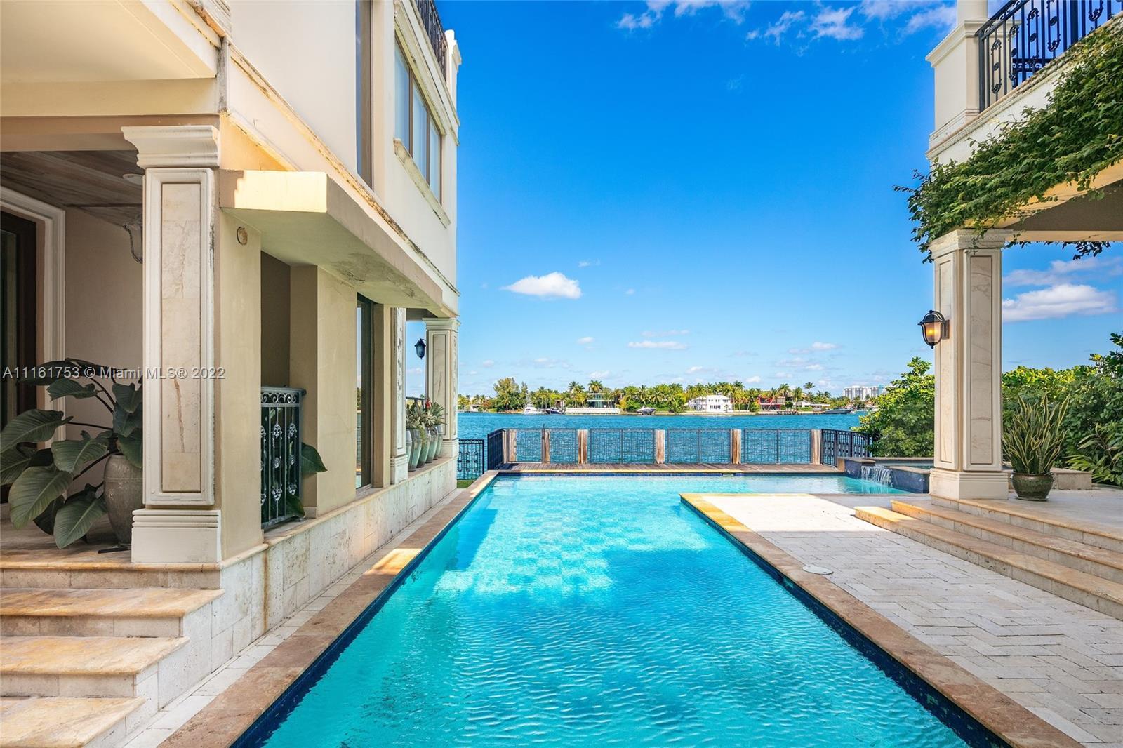Enjoy waterfront living overlooking the waters of pristine Biscayne Bay in this 3-story private, gat
