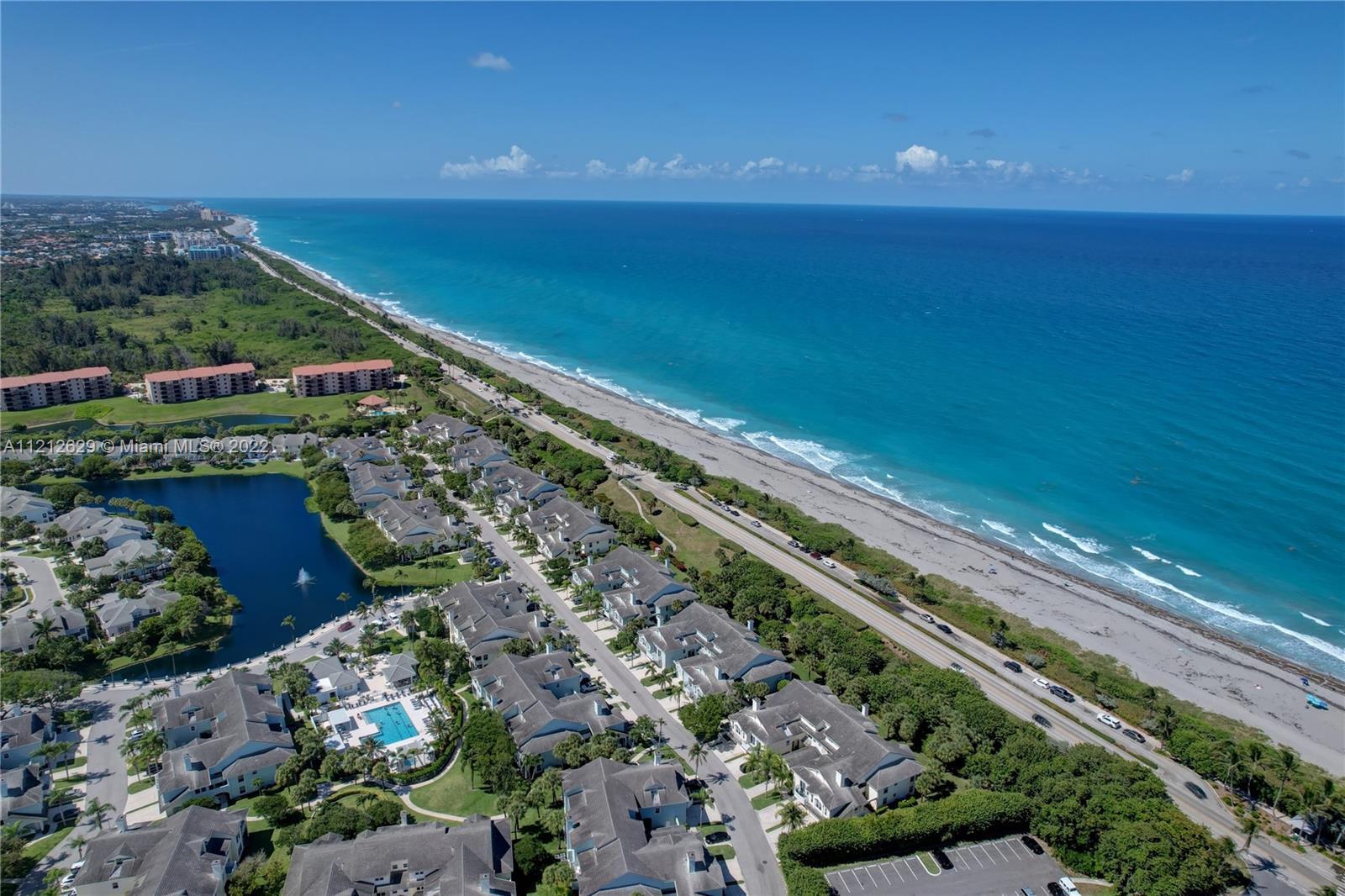 LOCATION! LOCATION! LIGHT, BRIGHT townhome steps from the beautiful turquoise waters of Jupiter beac