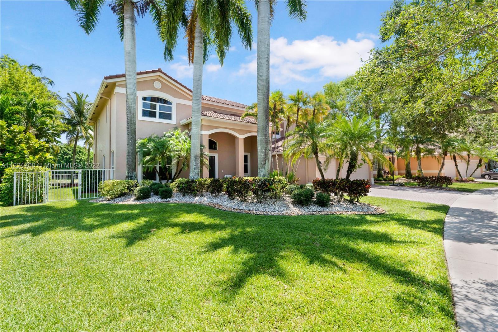A charming 6B/5BA waterfront home located in the prestigious resort style gated commnunity of Savann