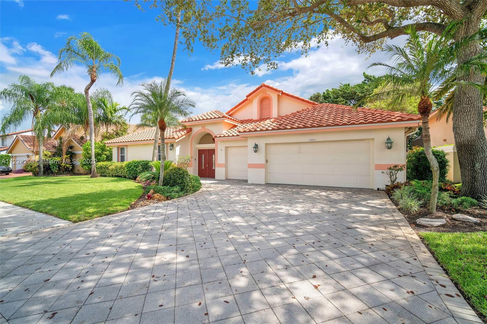 Coveted and rarely available courtyard pool home located in the desirable gated community of the Lau