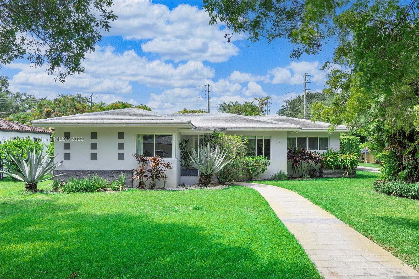 Spectacular mid-century modern pool home in Miami Shores. This home features a split floor plan with