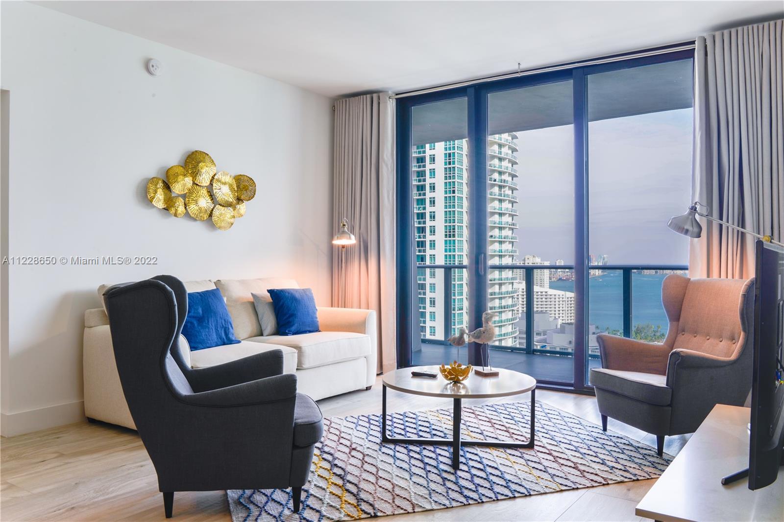 Spectacular upgraded unit at the iconic 1010 Brickell Condo. Unit features: 2 beds, 3 baths + den, a