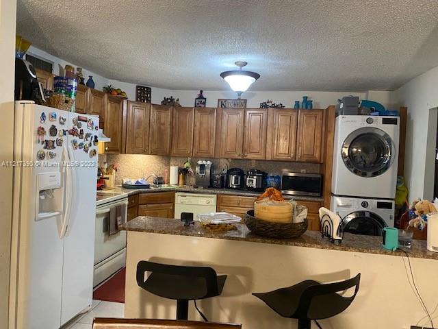 Unit all tiled in good condition with newer a/c unit, refrigerator and washer and dryer inside a new stove, hood and dishwasher will be installed. Please submit credit report, pay stubs and background check, prior to scheduling appointment.