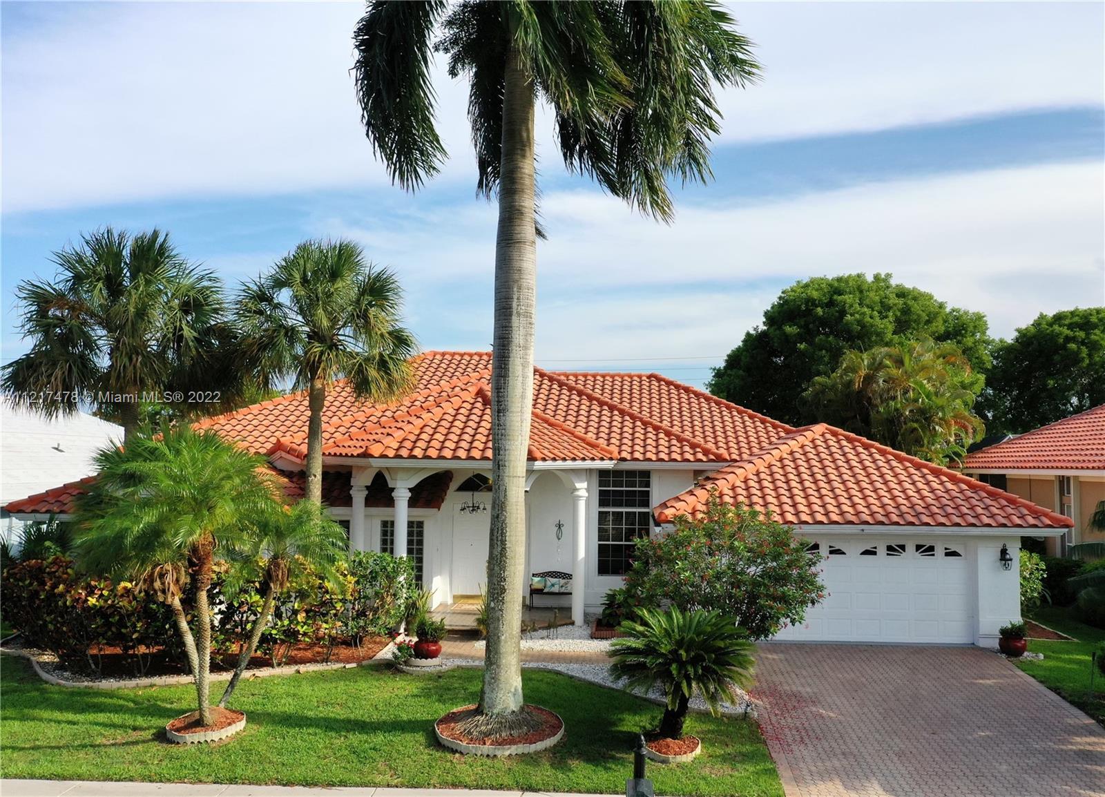 ABSOLUTELY OUTSTANDING,4/3 WITH OPEN FLOOR PLAN ROOM, LOCATED IN THE GATED COMMUNITY OF BOCA ISLES S