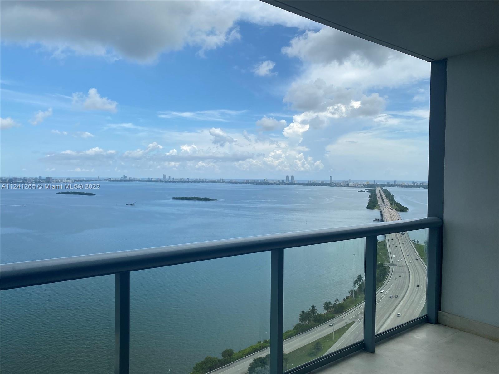 Magnificent bay views through floor-to-ceiling glass walls on 33rd floor on East side of the buildin