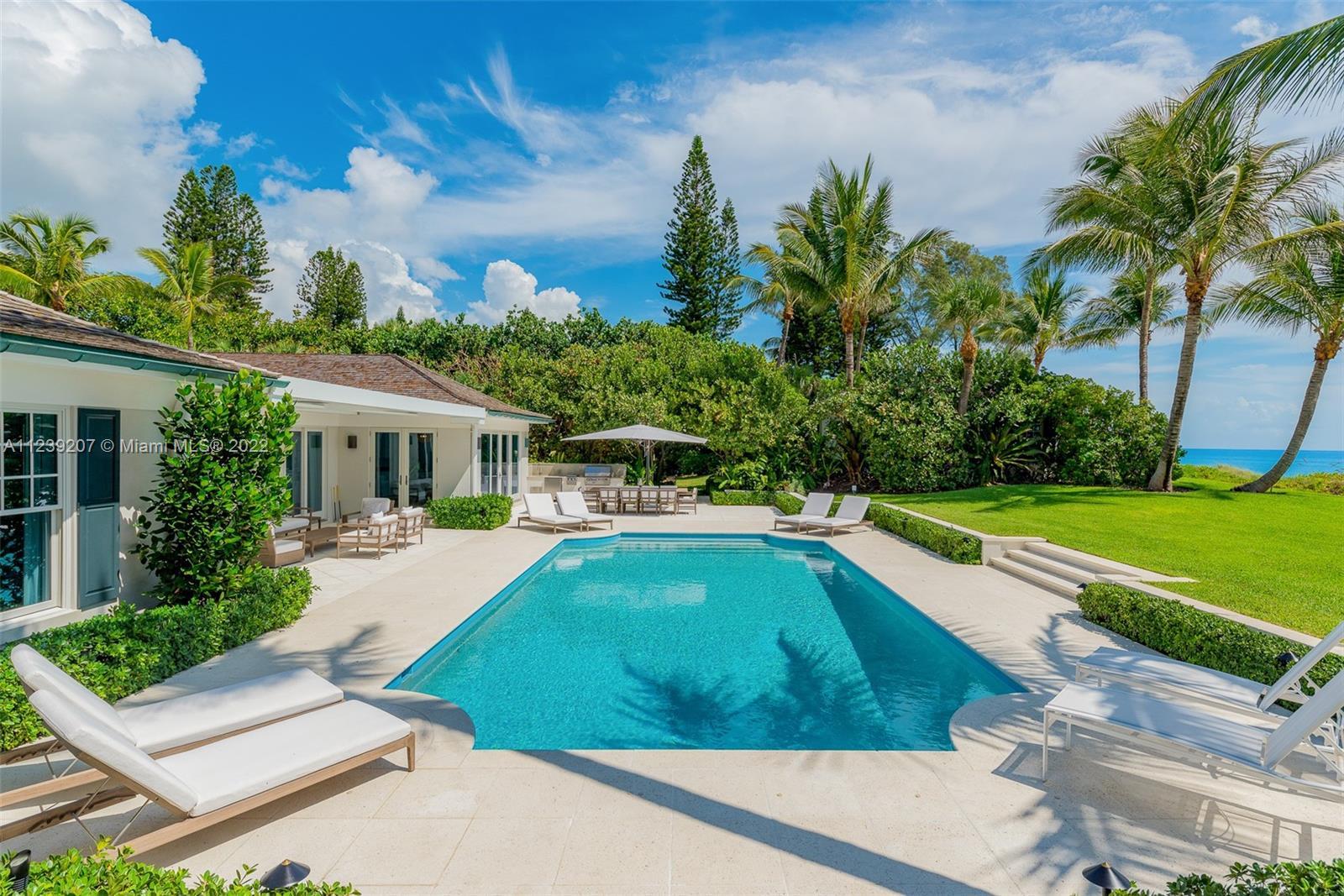 Direct oceanfront 1.53-acre one-of-a-kind Jupiter Island estate with a sprawling 200' of beach front