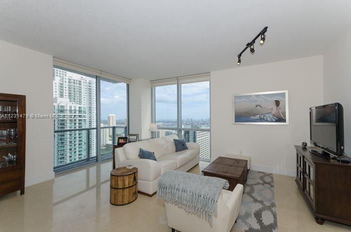 Spectacular large corner unit with amazing views in the heart of Brickell. This 2 Bed / 2.5 Bath lux