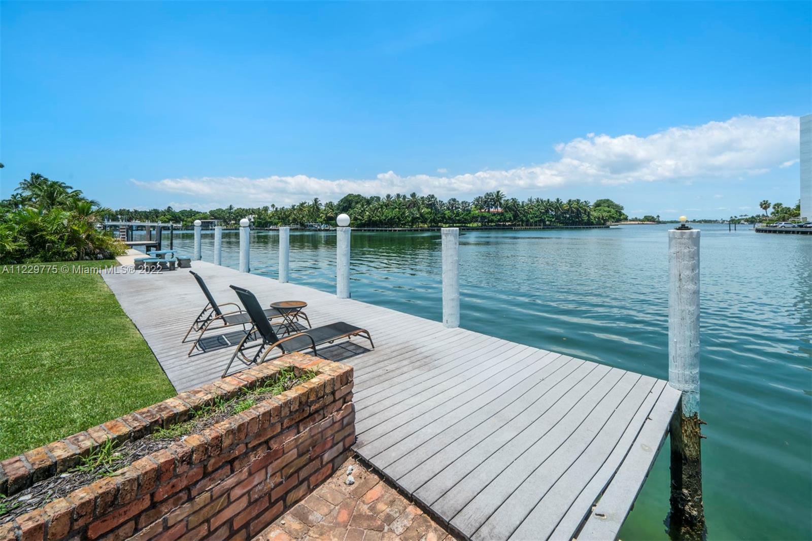 Largest waterfront lot available in all of Surfside. Live in coveted Surfside on this gorgeous water