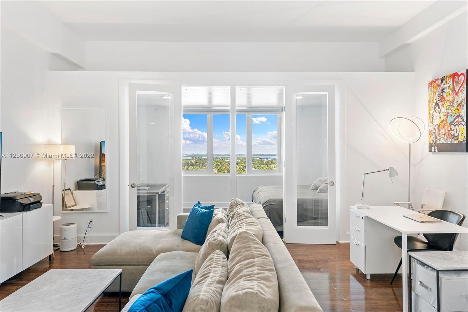 RARELY AVAIL 12" FT HIGH CEILING UNIT, w/GORGEOUS BAY & SUNSET VIEWS. Renovated w/wood floors & marb