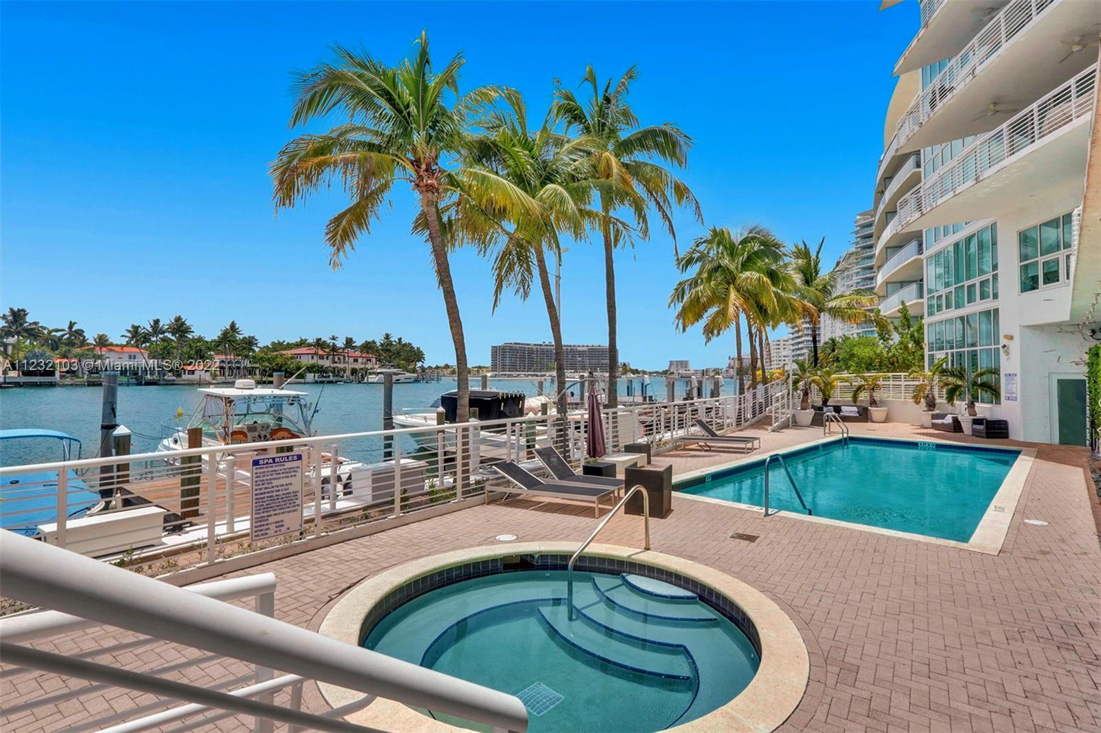Steps away from the beach and the intracoastal right in the back with a building private marina; thi