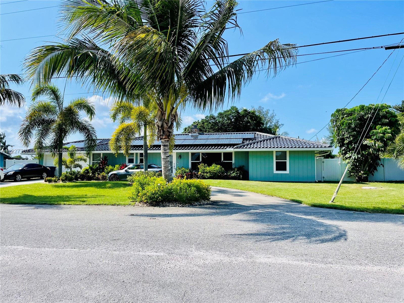 Welcome to 3131 Buccaneer Road. Your perfect NON-HOA Waterfront home in Lake Worth. Experience EASY 