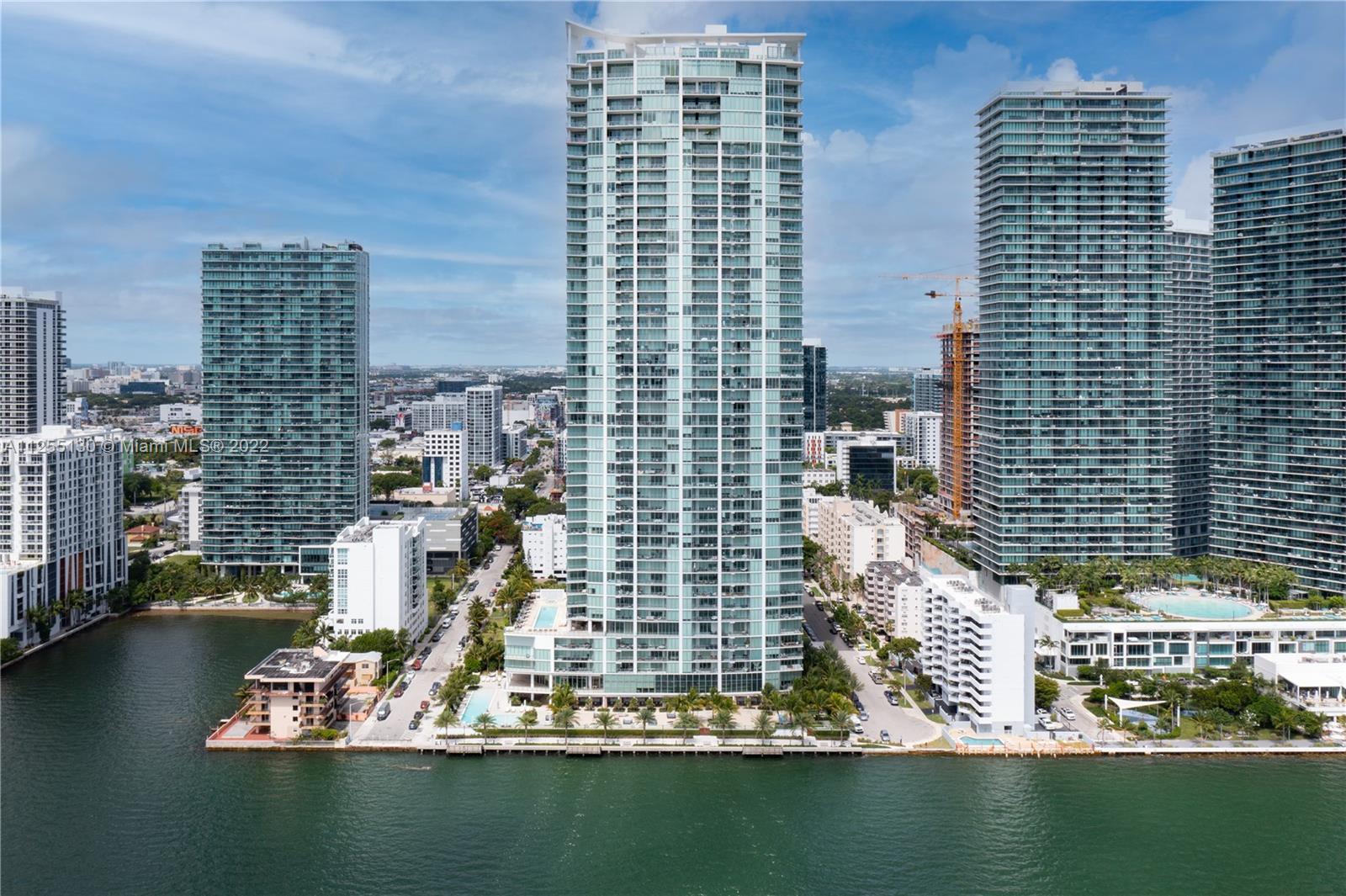 Beautiful three-bedroom, four-bathroom, south-east corner residence at bay-front Biscayne Beach with