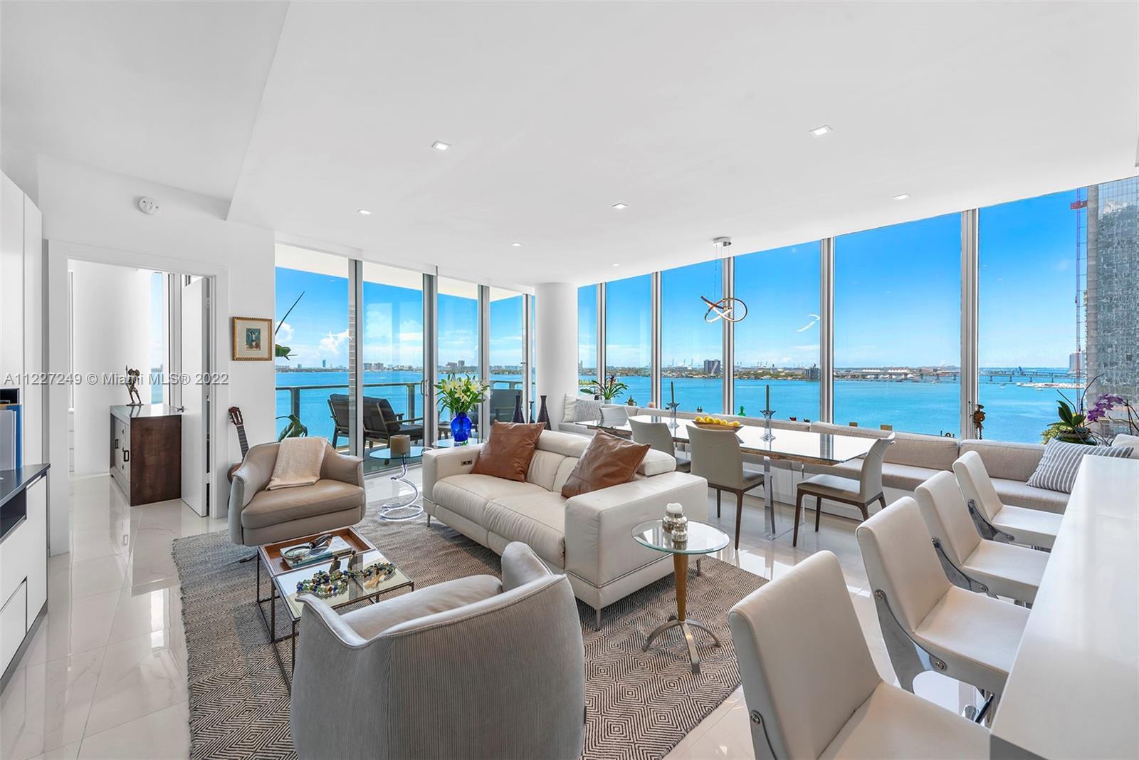 Spectacular bay & city views from this upgraded corner 3 Bed + den & 4 bath condo in the most covete