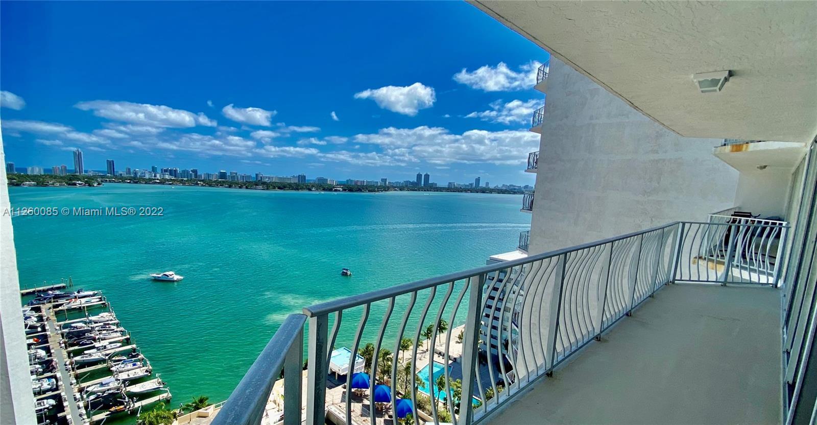 Unobstructed  and Direct East Views of Bay, Pool and Ocean!   Floor to ceiling glass doors with open