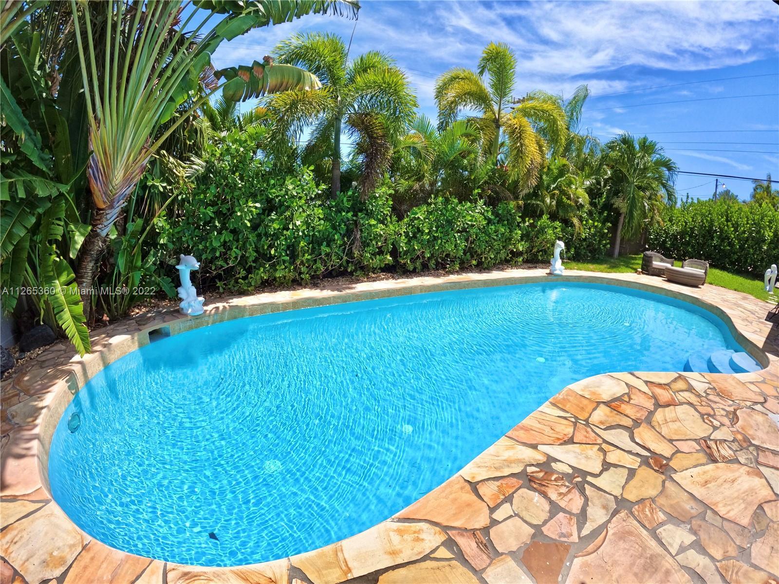Unique 3+1 Bedroom 3 Bath home in the beautiful neighborhood of Pompano Isles. Features a tropical o