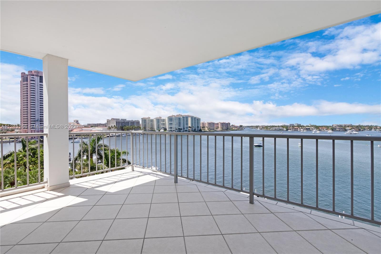 Rarely available and highly sought after H corner unit with direct water view of Lake Boca, views of