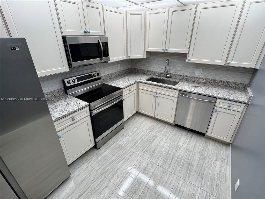 Gorgeous 2 Bed/2 Bath condo with remodeled kitchen/new appliances. Spacious living/dining room combo