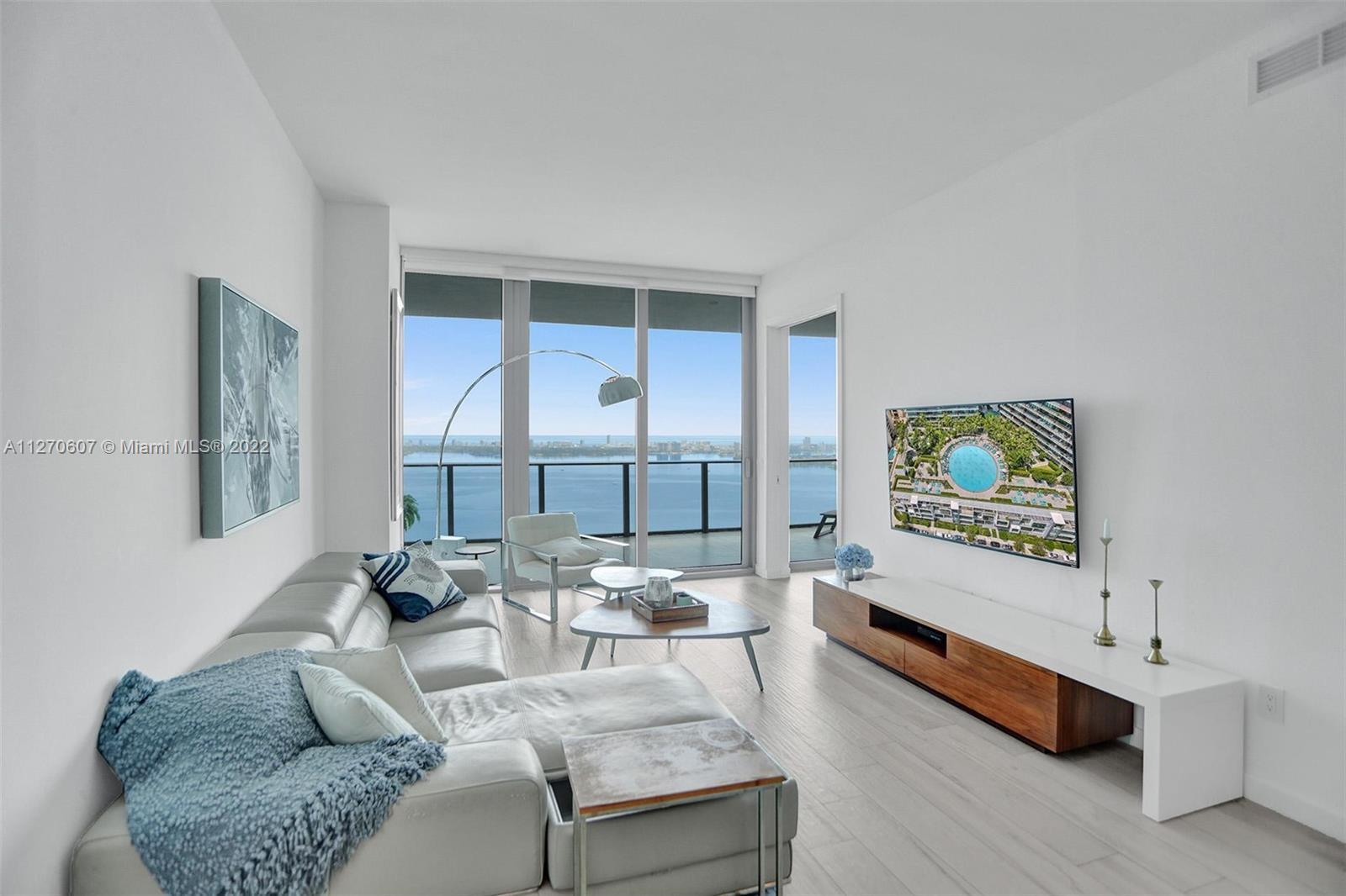 Enjoy breathtaking views from the 46th floor at Gran Paraiso Condo in Edgewater Miami. This spacious