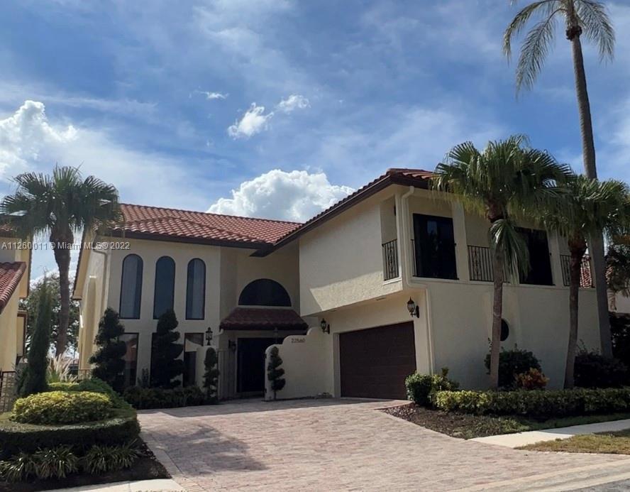 Two-story Mediterranean home in Boca Pointe Golf and Country Club that sits right on the 14th hole. 