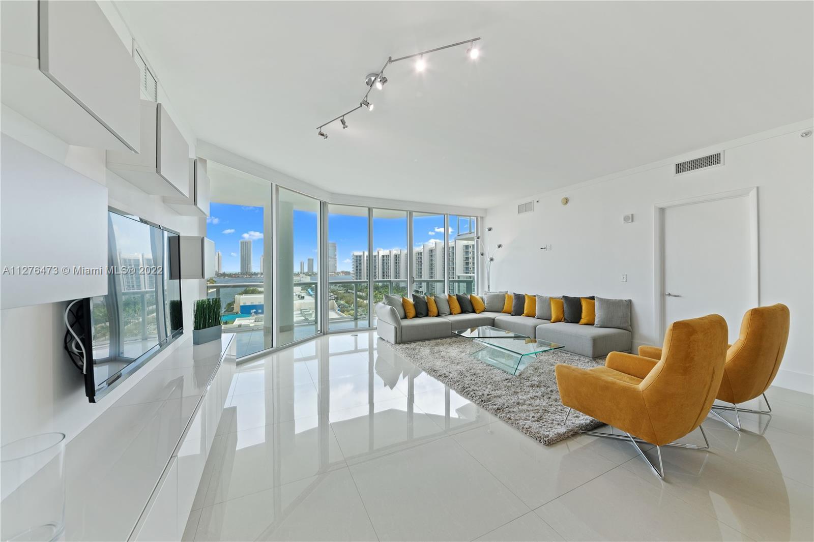 HIGHLY UPGRADED MODERN WATERFRONT CONDO IN THE HEART OF AVENTURA. THIS 2 BEDROOM/2.5 BATHROOM UNIT I