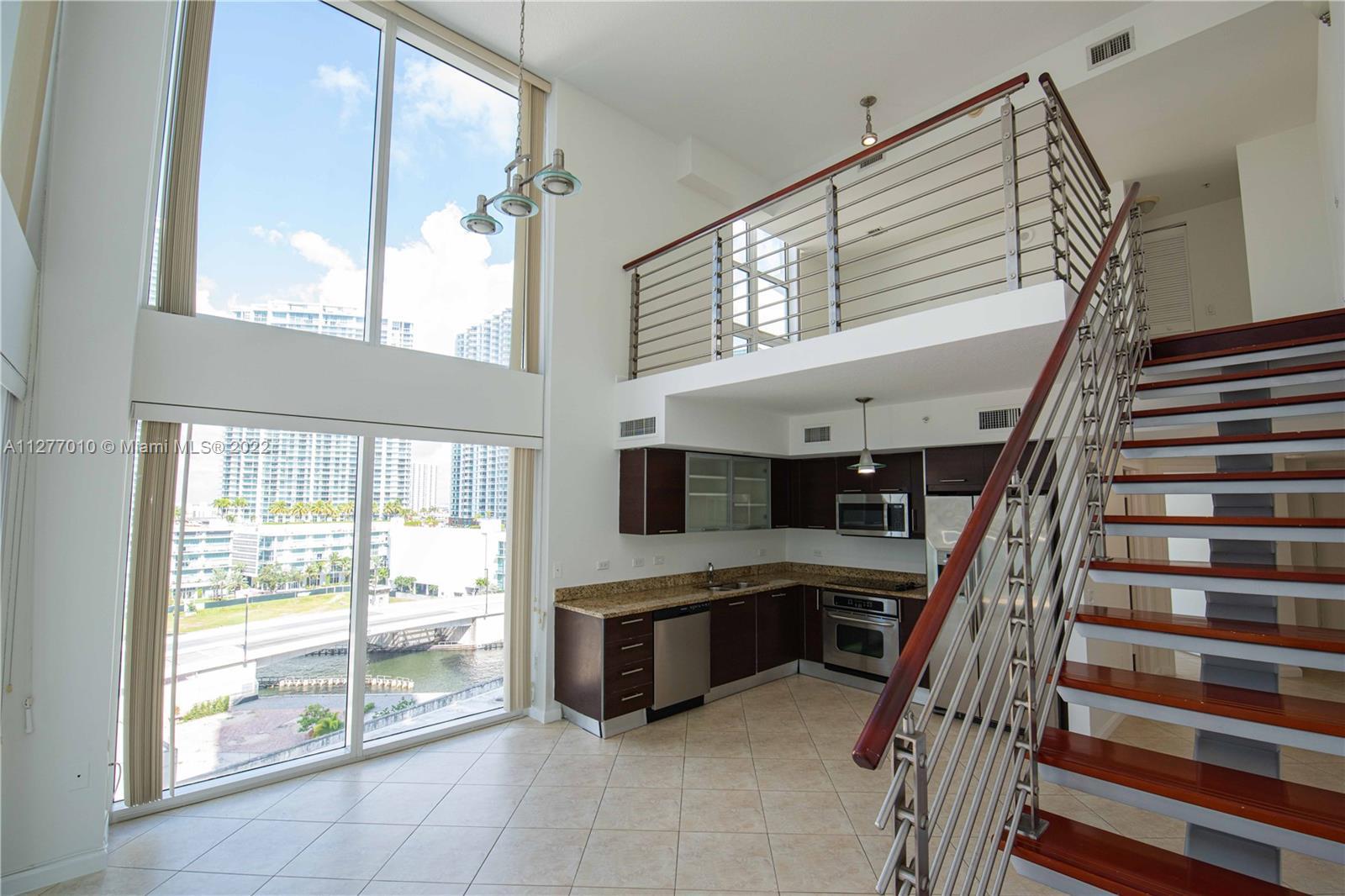 Live in the very heart of Brickell in this beautiful and spacious two-story loft. Featuring two gene