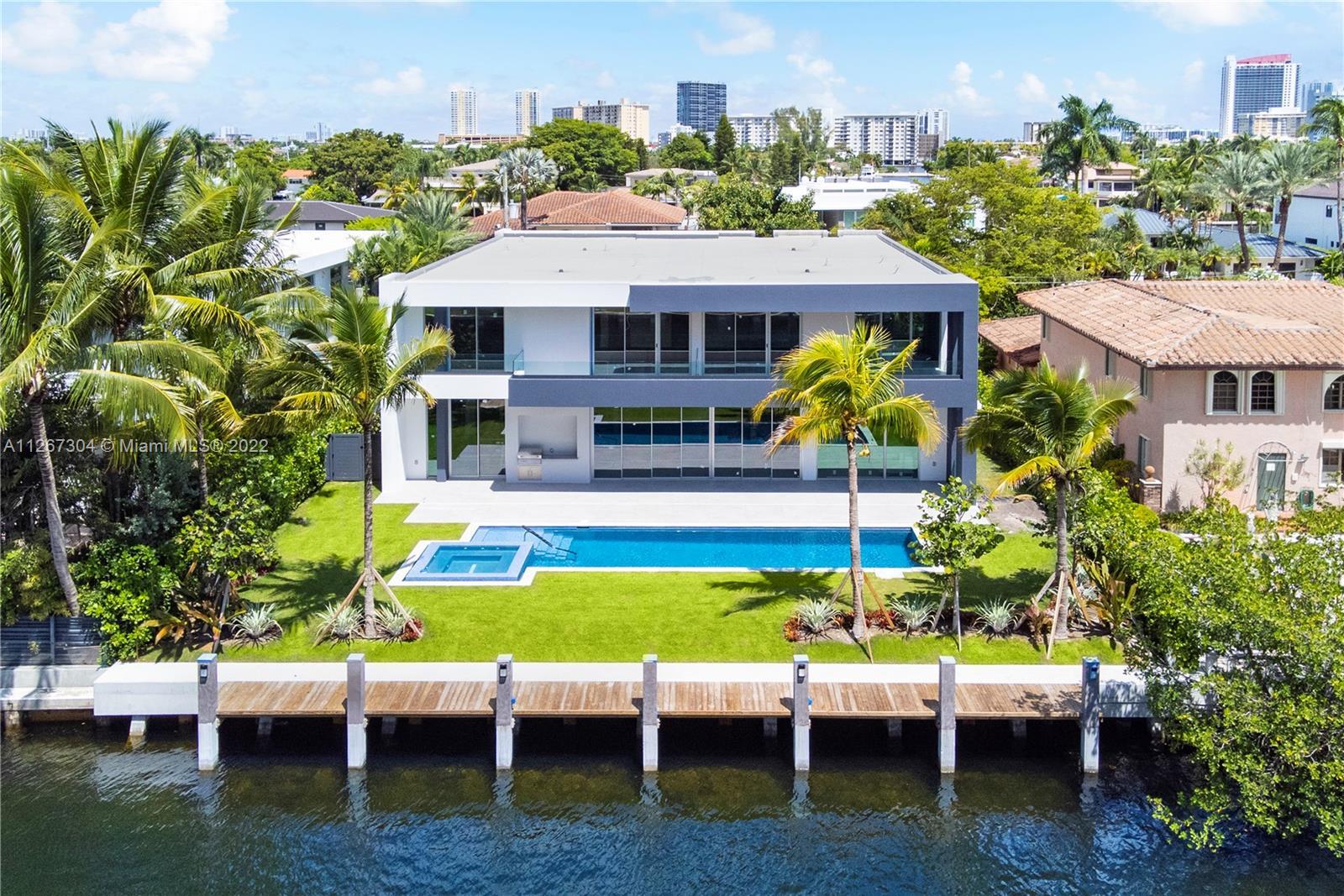 Experience the luxury lifestyle you deserve with this waterfront property in the exclusive gated com