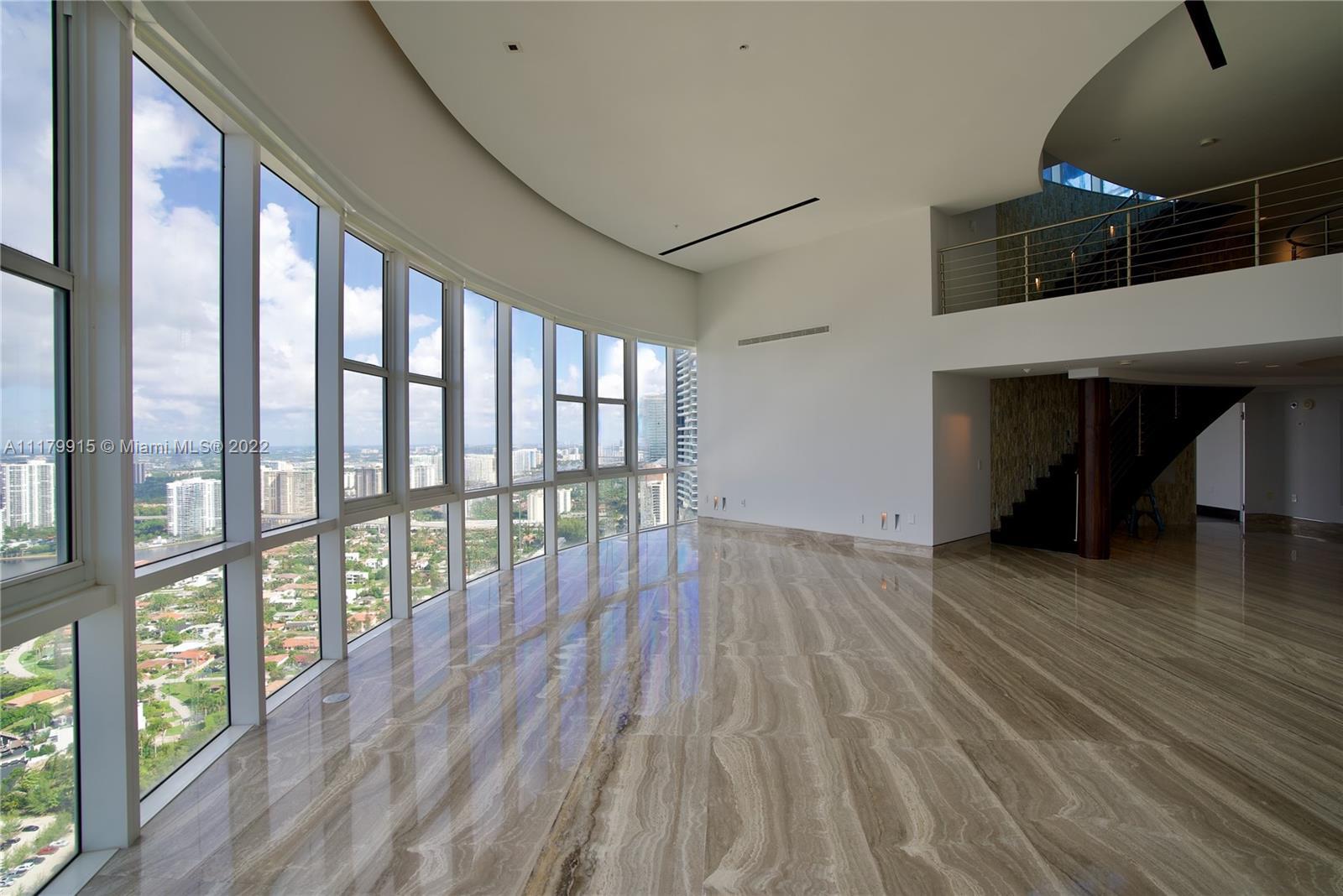 This fantastic PH on the 55th floor has a living room with soaring 22-foot ceilings, a one-of-a-kind