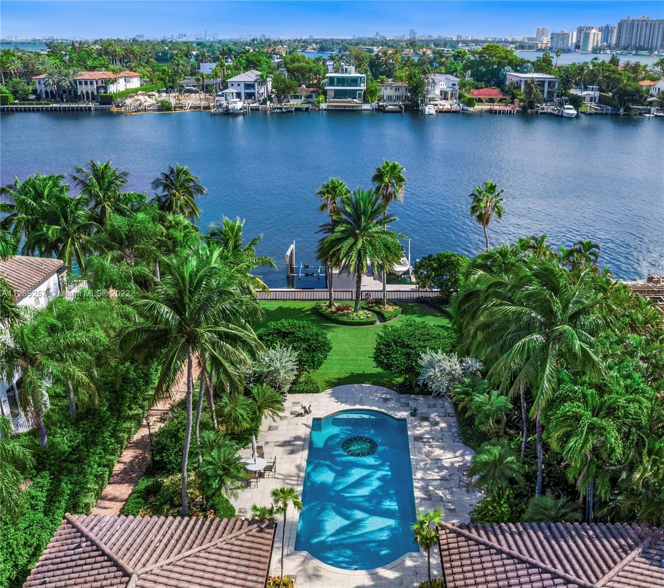Welcome to the perfect pairing of Palm Beach and Palm Island. Set on a lush 30,000 SF, this one stor